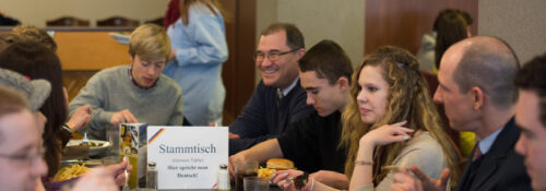 Students with Professor Fred Yaniga at a Stammtisch (German for 