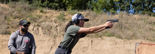 A student on the Hillsdale College Action Shooting Team practices at Hillsdale's John Anthony Halter Shooting Sports Education Center on Sept. 1, 2023.